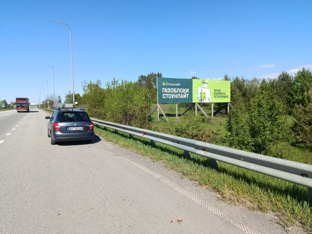 Щит 12x3,  Траса Житомир-Київ.Об'їздна Коростишева. Напроти комплексу"Вояж", напрямок з Житомира на Київ, 3х12 ст.А